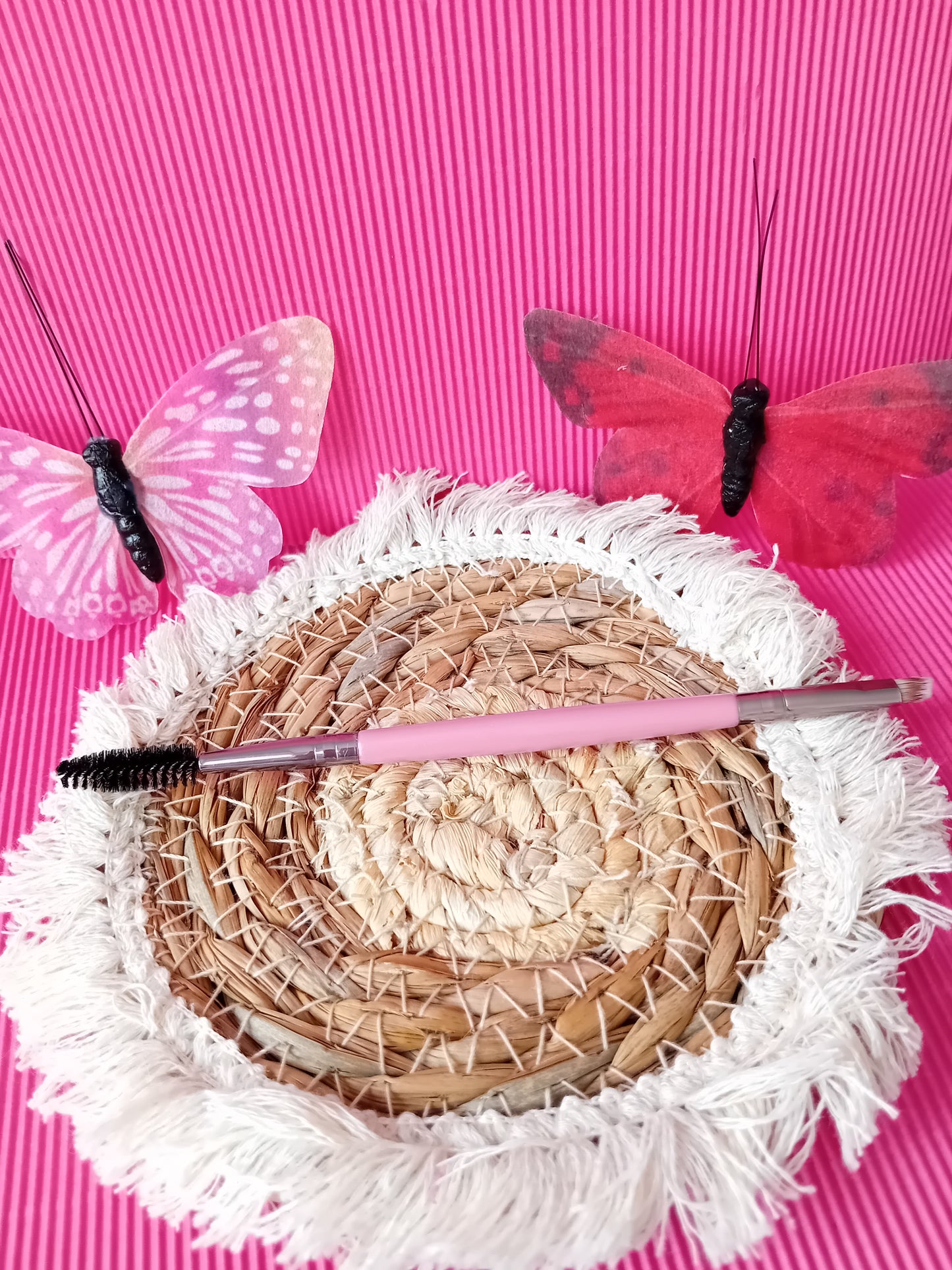 Pink eyebrow brush